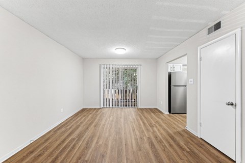 the living room of our studio apartment atrium with a refrigerator